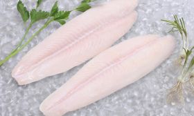 Frozen Pangasius Fish Fillet laid on a bed of ice